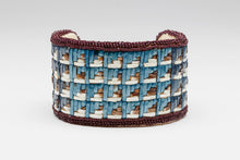 Bracelet depicting Cloud Design by Melanie Tallmadge Sainz, Ho-Chunk Nation