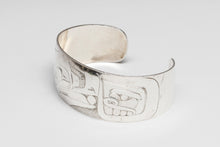 Bracelet depicting Raven and Human by Norman Tait, Nisga'a