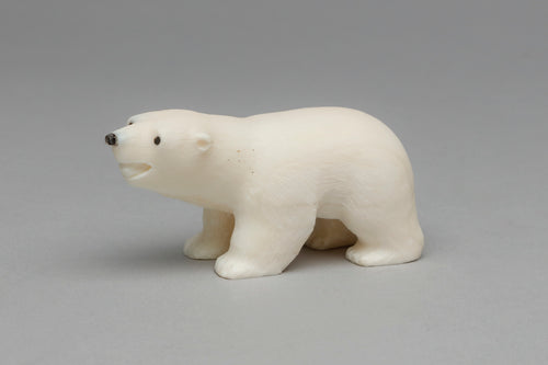 Carving depicting Polar Bear Cub by Ronnie Toolie, Yup'ik