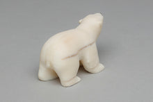 Carving depicting Polar Bear Cub by Ronnie Toolie, Yup'ik