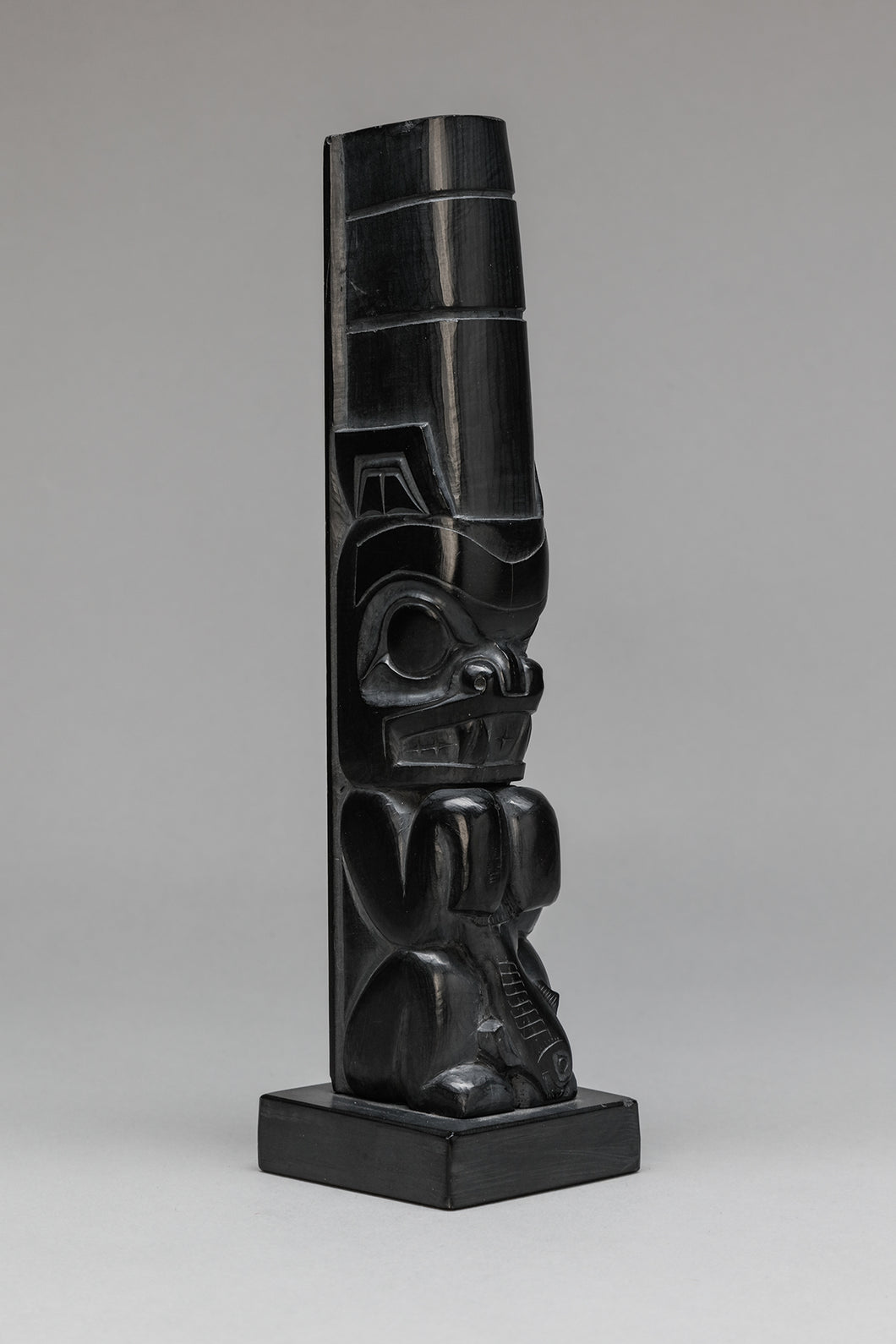 Argillite Totem depicting Potlatch Bear with Salmon by Clarence Mills, Haida