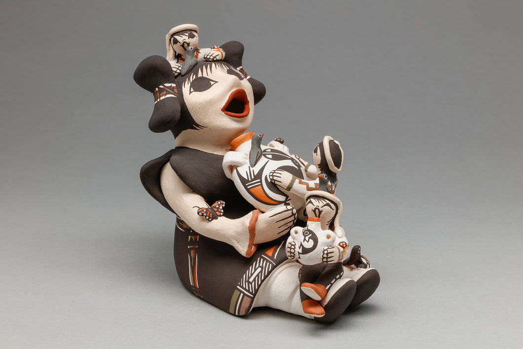 Storyteller Holding Pot and 3 Kids by Marilyn Ray, Acoma Pueblo